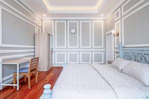 Postel nebo postele na pokoji v ubytování Desa Residence