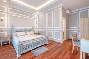 Postel nebo postele na pokoji v ubytování Desa Residence