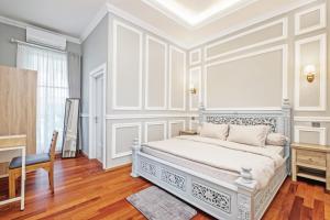 Postel nebo postele na pokoji v ubytování Desa Residence