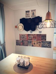 a pair of tea pots on a table in a room at Qloud Cottage in Ranau