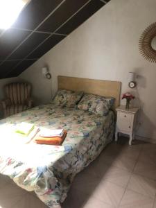 a bedroom with a bed with books on it at Moradia São Romão in Torrão