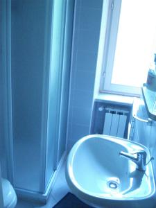 a bathroom with a sink and a shower at Locanda Del Barbaresco in Alba +24 photos