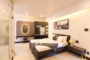 a bedroom with a bed and a walk in closet at HT House in Da Lat