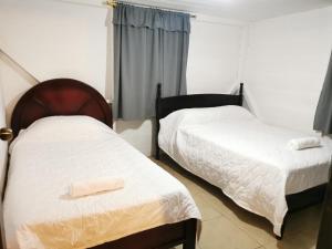 Un pat sau paturi într-o cameră la Finca Los Guayacanes