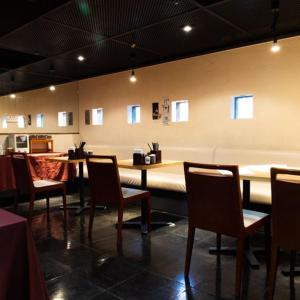 a restaurant with a long table and chairs in a room at Ramada Encore by Wyndham Amagasaki in Amagasaki