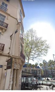 a building with a sign on the side of it at appartement perpignan in Perpignan