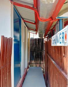 a hallway of a building with a sign on it at Footprints Hostel in Coron