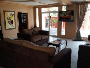 Μια τηλεόραση ή/και κέντρο ψυχαγωγίας στο Apart Hotel Pico Bonito