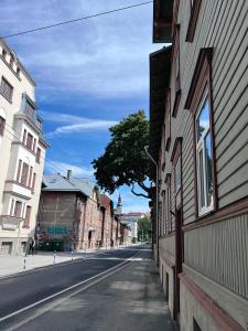 an empty street in a city with buildings at Mo&Ko Snelli Apart - Self Check-in - 5 min from Old Town in Tallinn