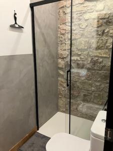 a shower with a glass door in a bathroom at Charmant appartement cosy in Saint-Raphaël