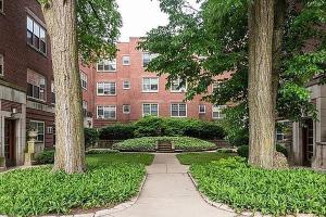 a walkway in front of a building with trees at Evanston 1br w courtyard wd nr beach CHI-955 in Evanston