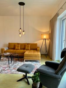 a living room with a couch and a table at Appartements Haus Augustinus in Münster