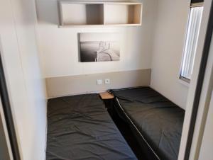 Кровать или кровати в номере Havre de paix Carabasse VI 58