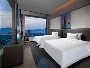 Postel nebo postele na pokoji v ubytování Hampton By Hilton Hangzhou Future Sign Technology City + 37 fotografií