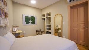 Giường trong phòng chung tại Bono Hotel Old Town