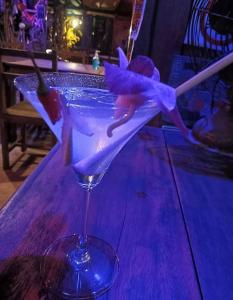 a martini glass sitting on top of a table at Ko Yao Noi Sabai Bungalows in Ko Yao Noi