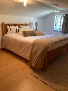 a bedroom with a large bed in a room at A Casa da Rapariga de Cabelo Azul in Manteigas