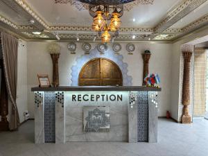 a reception desk in a room with a ceiling at HOTEL UZBEGIM in Urganch