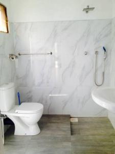Koupelna v ubytování New Manik Homestay