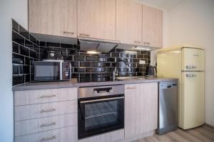 Kuchyňa alebo kuchynka v ubytovaní Promenada Lipno Apartment 123