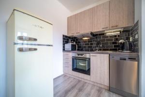 Kuchyňa alebo kuchynka v ubytovaní Promenada Lipno Apartment 123