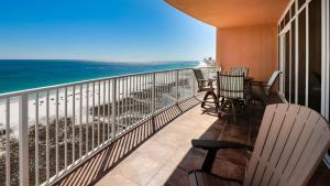 a balcony with chairs and a view of the ocean at Phoenix Orange Beach II 1104 in Orange Beach +45 photos
