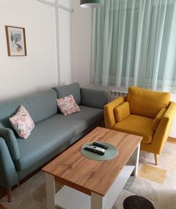 a living room with a couch and a coffee table at Apartment Eight - Pirot in Pirot