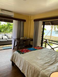 Postel nebo postele na pokoji v ubytování Entire Private Beachfront Villa in Siargao