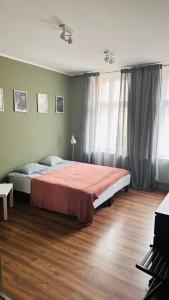Posteľ alebo postele v izbe v ubytovaní Dworcowa - Apartament