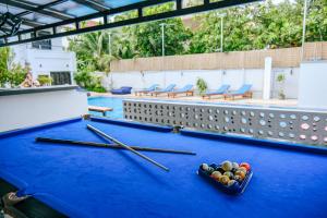a ping pong table with chopsticks and balls on it at The Big Easy Siem Reap in Siem Reap
