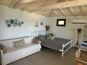 A bed or beds in a room at Maroudio's Villa