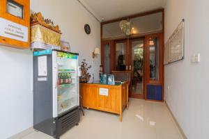 a room with a refrigerator and a counter in it at Prama Beach Canggu by The Loka in Canggu