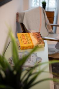 a book sitting on top of a table at Laonikos Seaside Urban Studio SKG in Thessaloniki