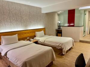 Postelja oz. postelje v sobi nastanitve Bamboo Hotel
