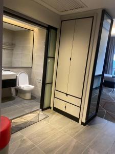 a bathroom with a toilet and a sink at Studio Bedroom with Balcony in Kuala Lumpur