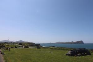 a campsite with a view of the water at The Old Pier Guest Accommodation, bed only, no breakfast in Ballydavid