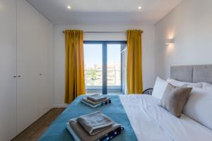 Ένα ή περισσότερα κρεβάτια σε δωμάτιο στο Apartamento Appartimao +31 φωτογραφίες