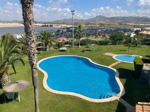 The swimming pool at or close to Stunning 3-Bed Apartment in Puerto De Mazarron