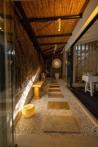 a room with a hallway with benches and a ceiling at ZOE ALAÇATI in Alacati