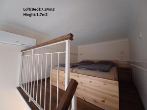 Postel nebo postele na pokoji v ubytování Loft House Budapest