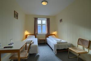 Postel nebo postele na pokoji v ubytování Ebsens Hotel