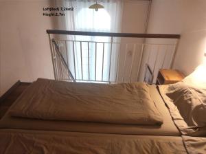 Postel nebo postele na pokoji v ubytování Loft House Budapest