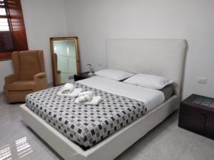Ένα ή περισσότερα κρεβάτια σε δωμάτιο στο Casa Maestrina