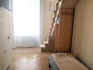 Postel nebo postele na pokoji v ubytování Loft House Budapest