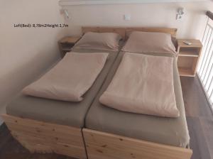 Postel nebo postele na pokoji v ubytování Loft House Budapest