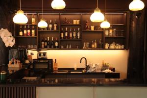 a bar with a counter and some bottles of alcohol at Le Baan Thai Boutique Villa in Chiang Mai