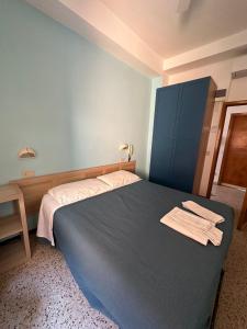 Een bed of bedden in een kamer bij Hotel Sylva