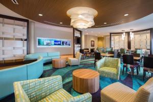 a lobby of a hotel with tables and chairs at SpringHill Suites by Marriott Mount Laurel in Mount Laurel