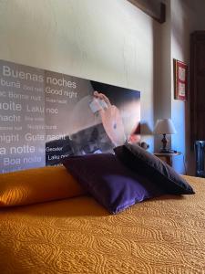 a stuffedanimal is on top of a pillow on a bed at La Casita del Patio in Bernardos +12 photos