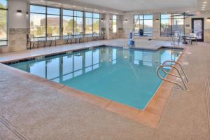 a large pool with blue water in a building at Hampton Inn Suites Flagstaff East in Flagstaff